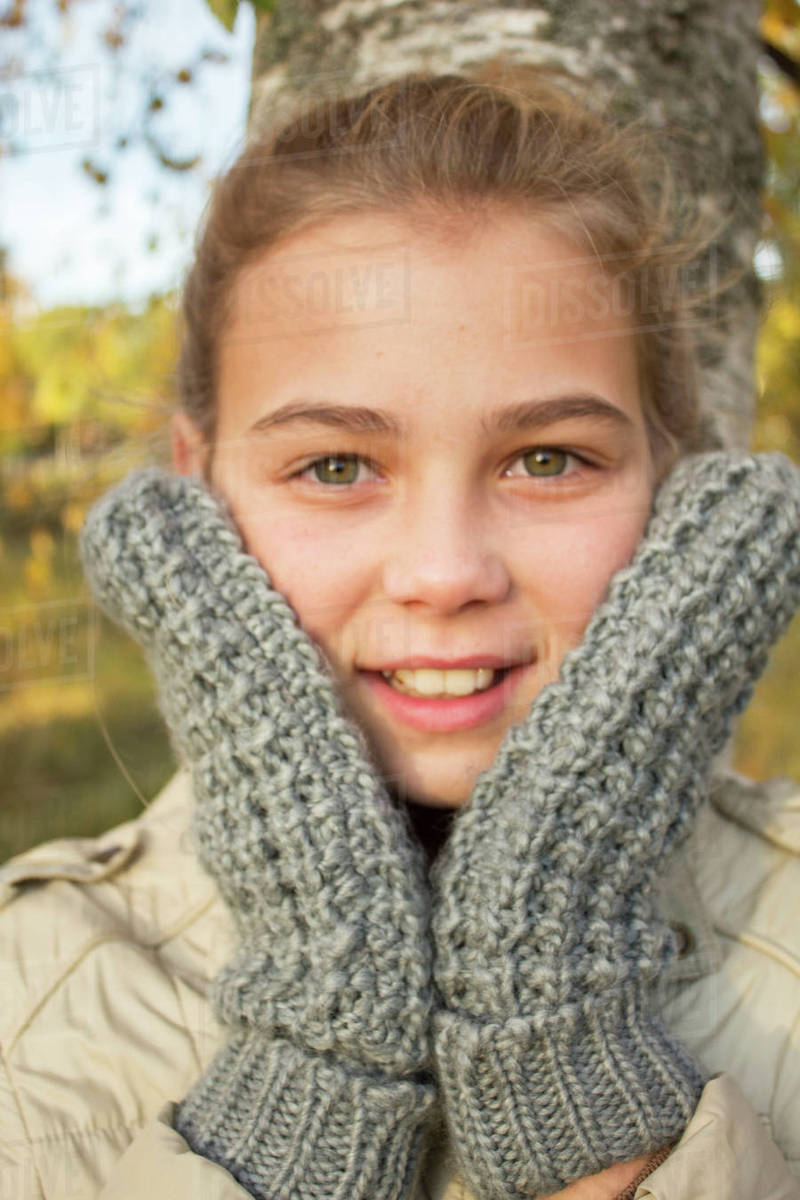 Portrait of girl wearing gloves Stock Photo Dissolve