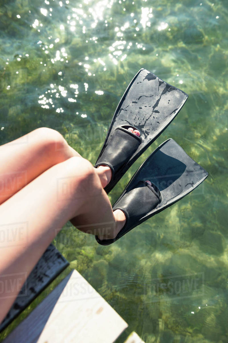 Child wearing flippers, closeup Stock Photo Dissolve