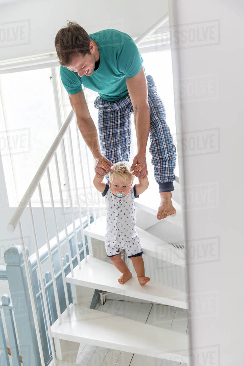 Father with son on stairs Stock Photo Dissolve