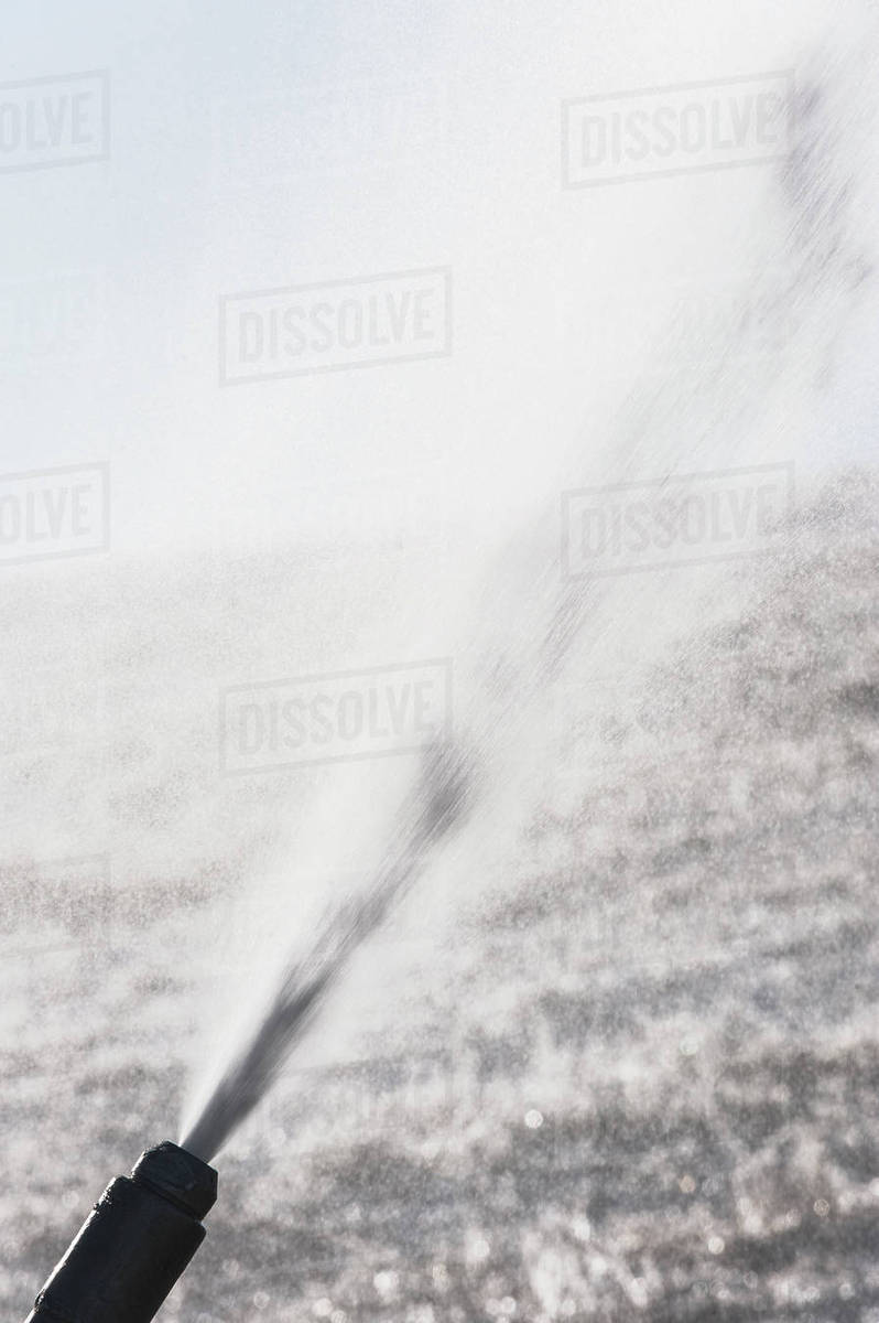 Water flowing through hose Stock Photo Dissolve
