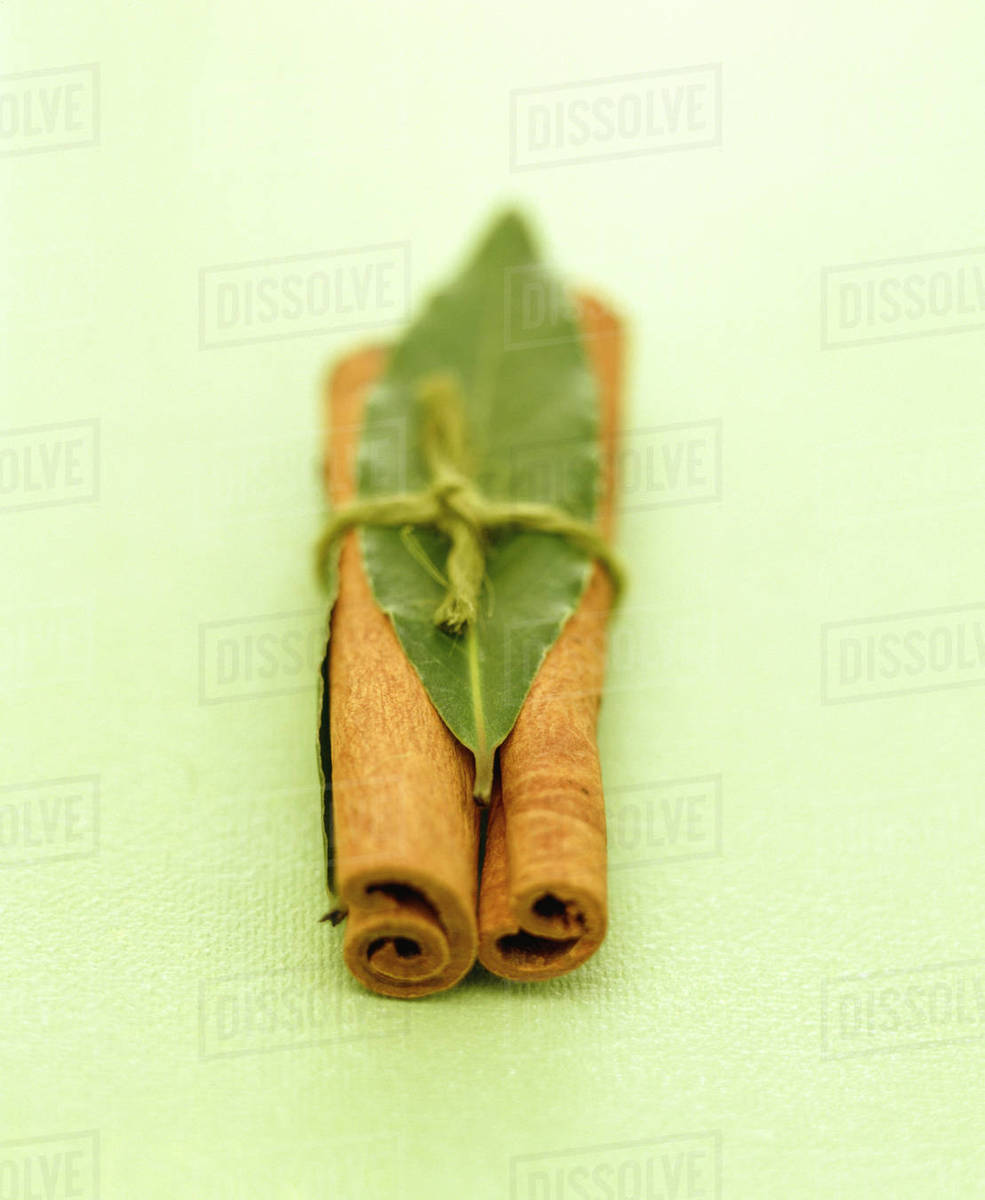 Cinnamon Sticks Wrapped In Leaf Stock Photo Dissolve