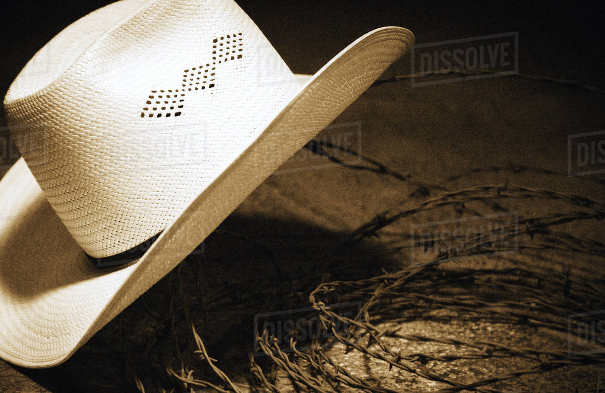 Cowboy Hat And Barbed Wire Stock Photo Dissolve