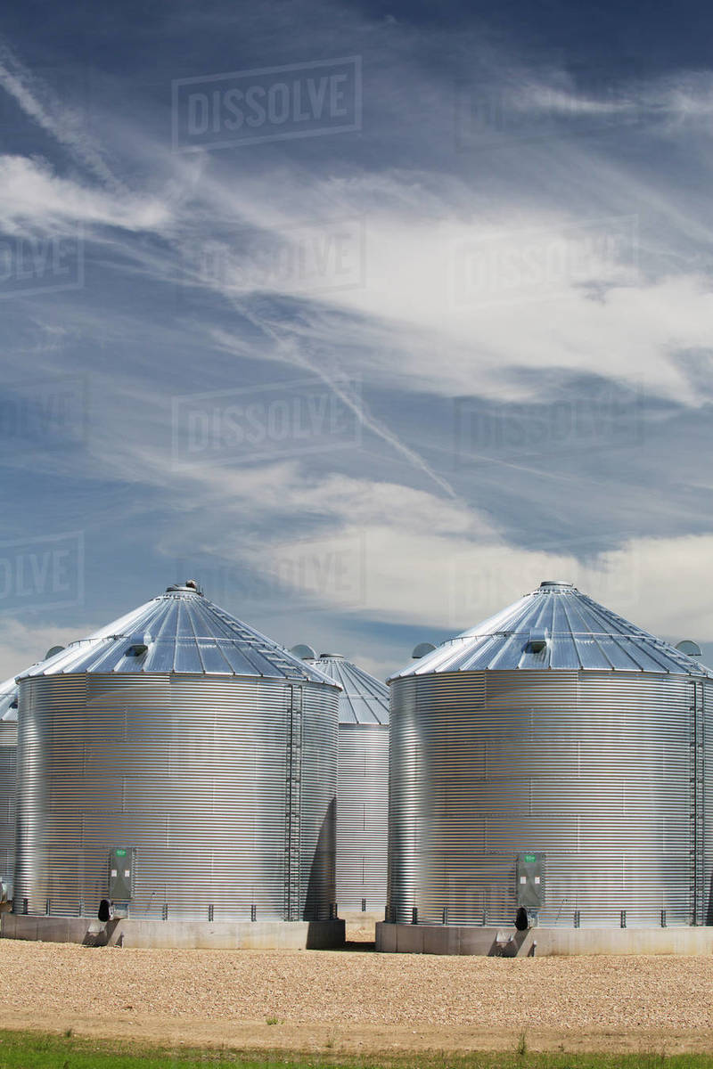 Metal Grain Bins; Alberta, Canada Stock Photo Dissolve