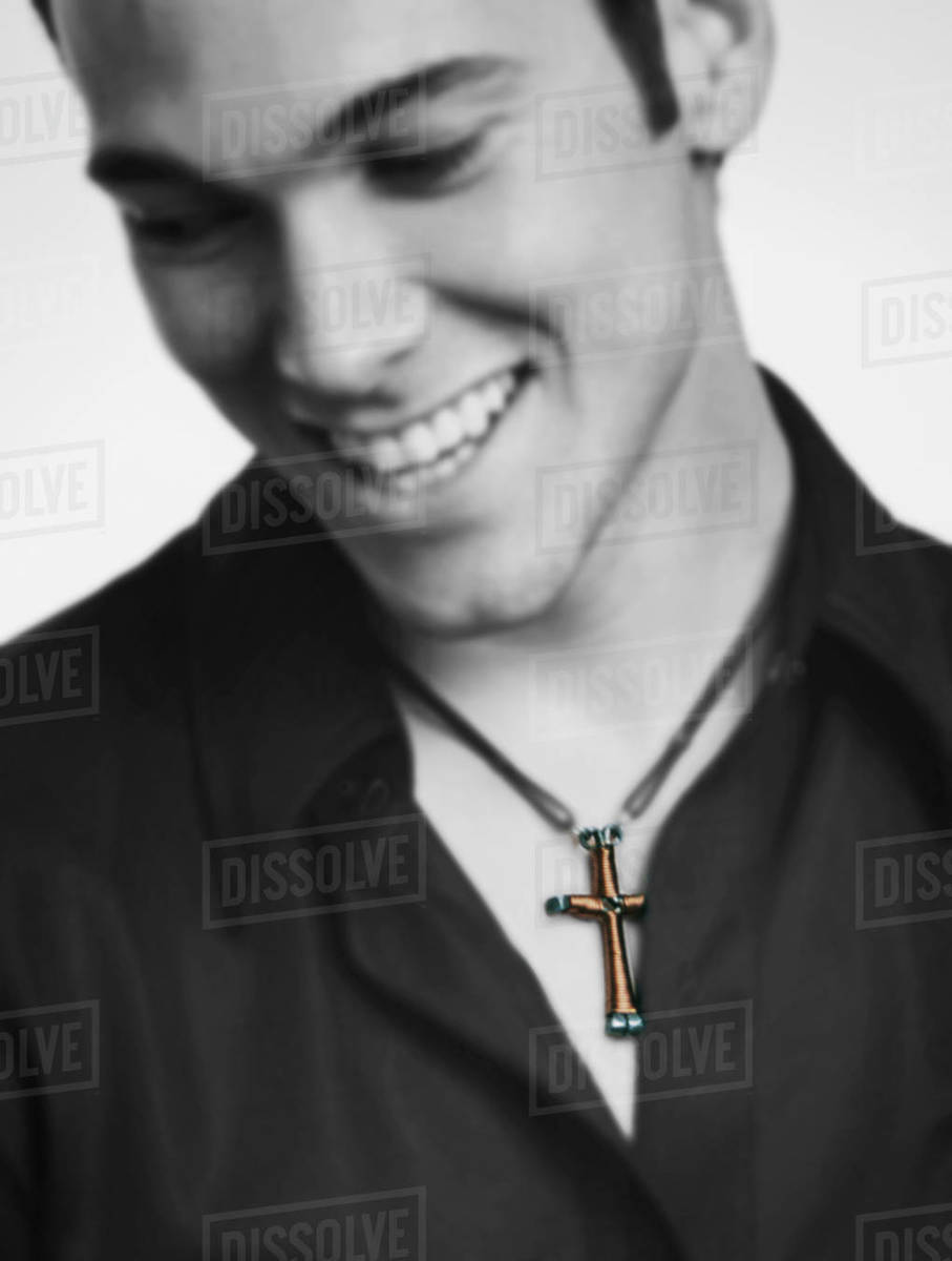 Man Wearing A Cross Stock Photo Dissolve