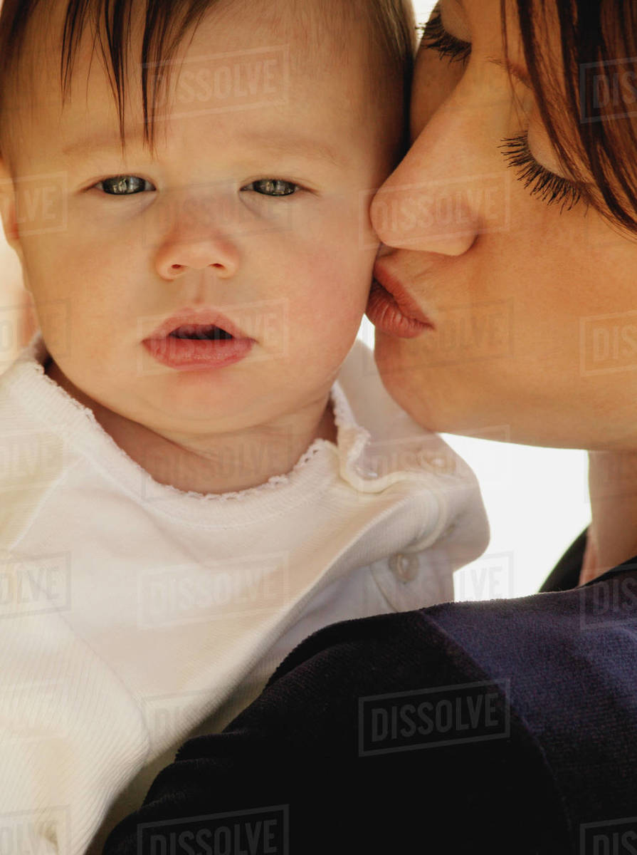 Loving Mother Kissing Her Small Baby HooDoo Wallpaper