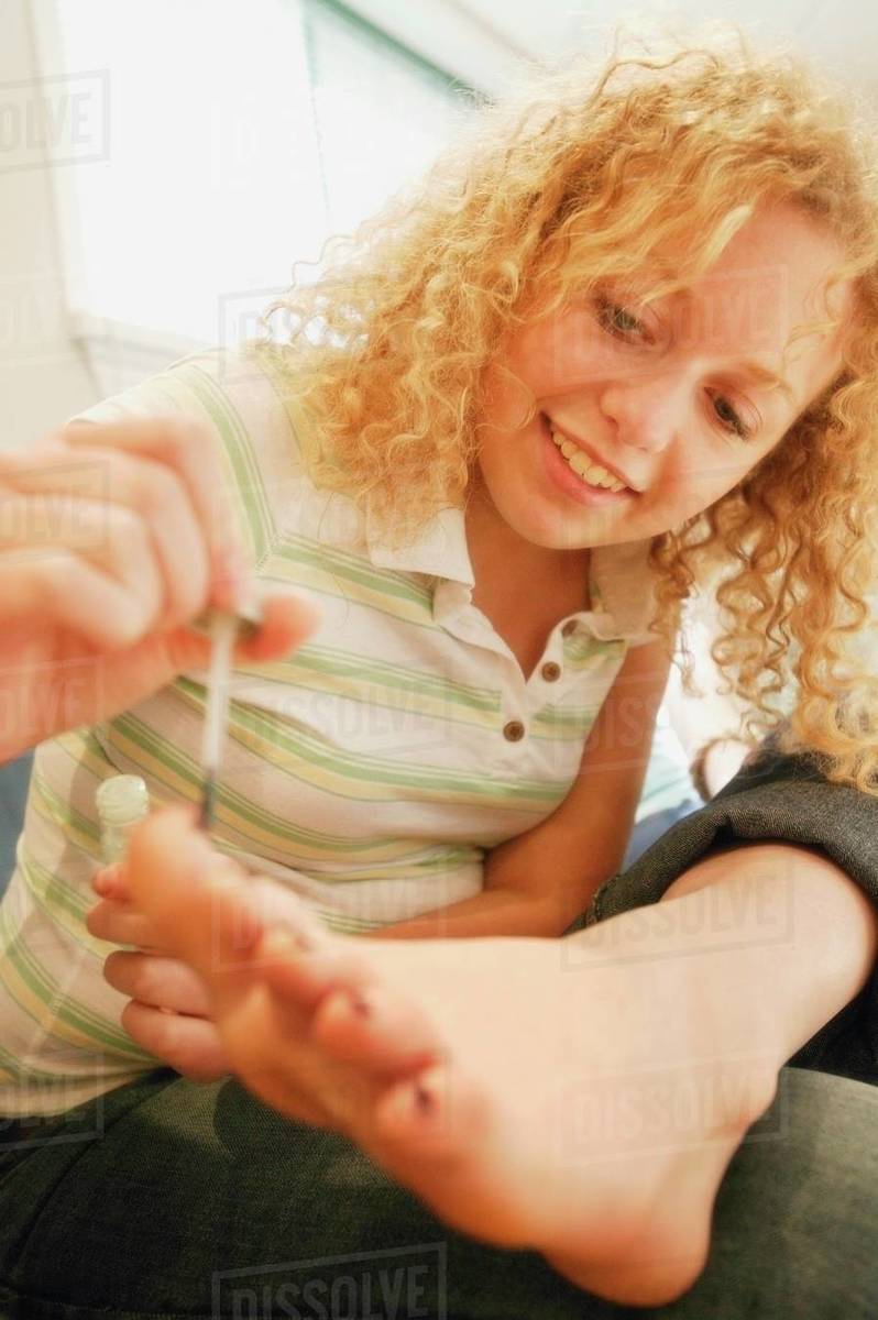Putting On Nail Polish Stock Photo Dissolve