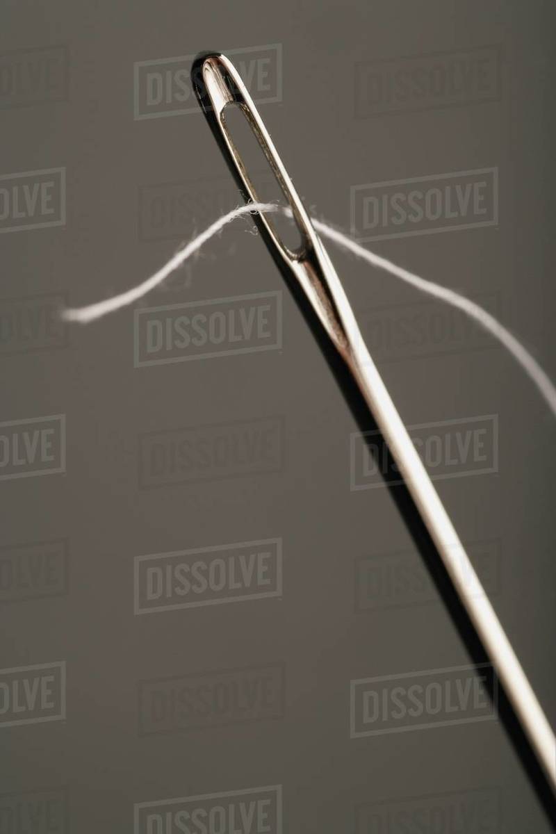 Needle Being Threaded Stock Photo Dissolve