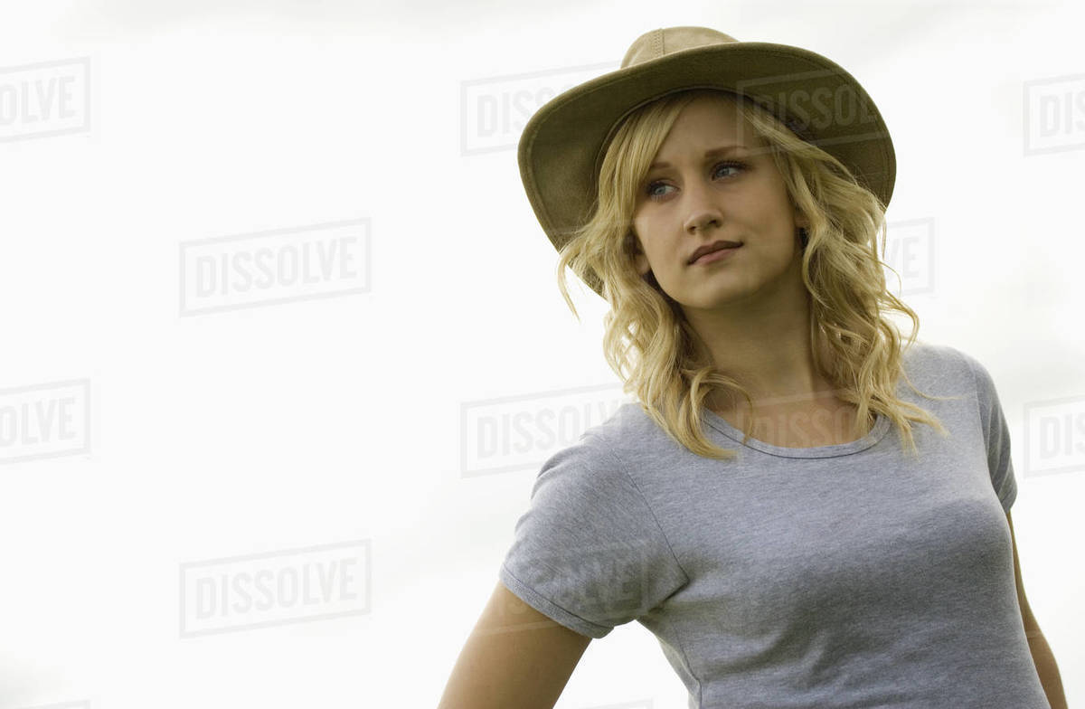 Young Lady Wearing A Hat Stock Photo Dissolve