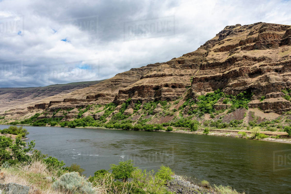 Wild Snake River and the exposed geologic and eroding cliffs as seen