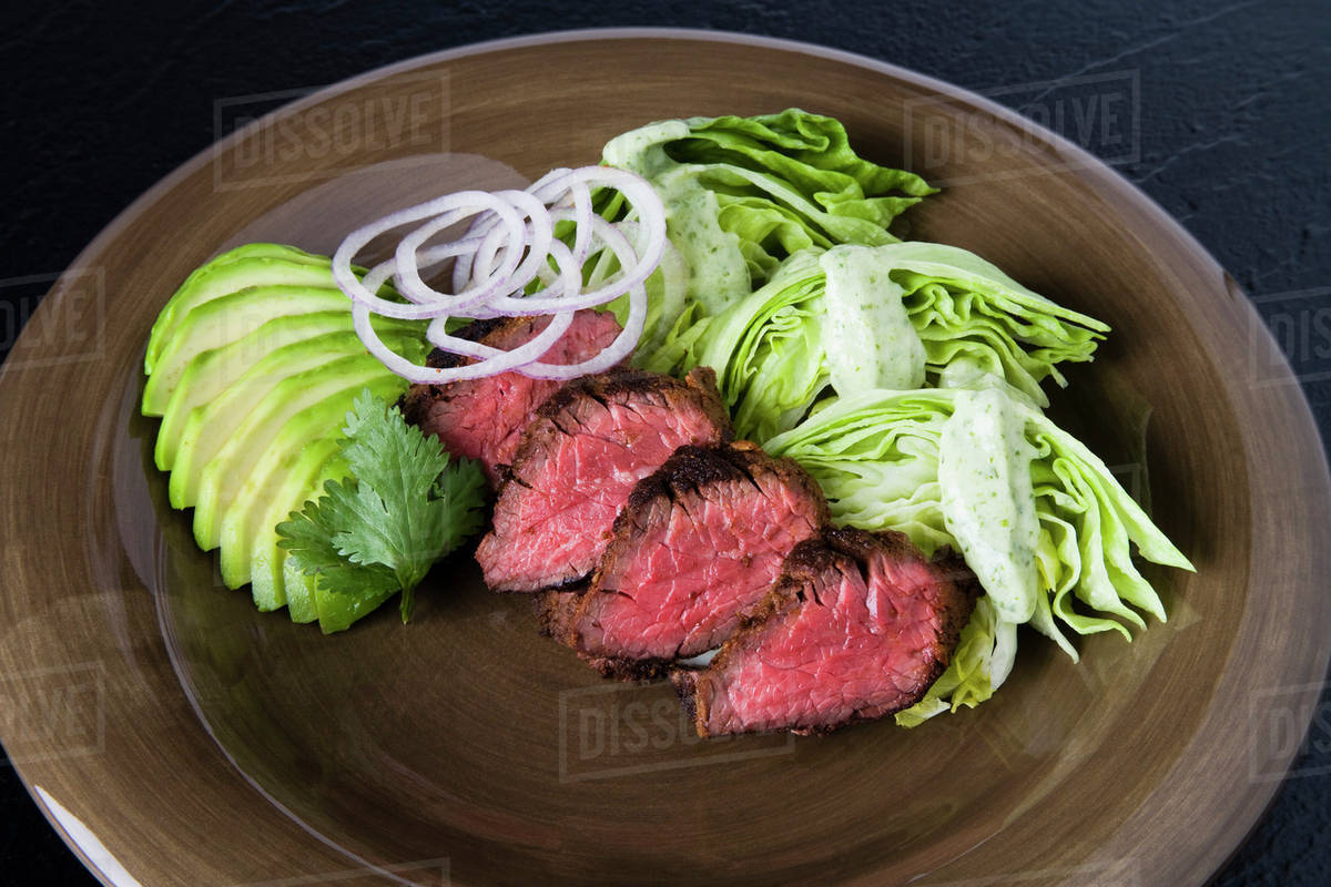 Food Cuban Hanger Steak served with baby Iceberg lettuce wedges