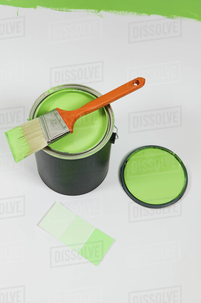 Open Paint Can, Lid, Colour Swatch And Brush, Canada, British Columbia Stock Photo Dissolve