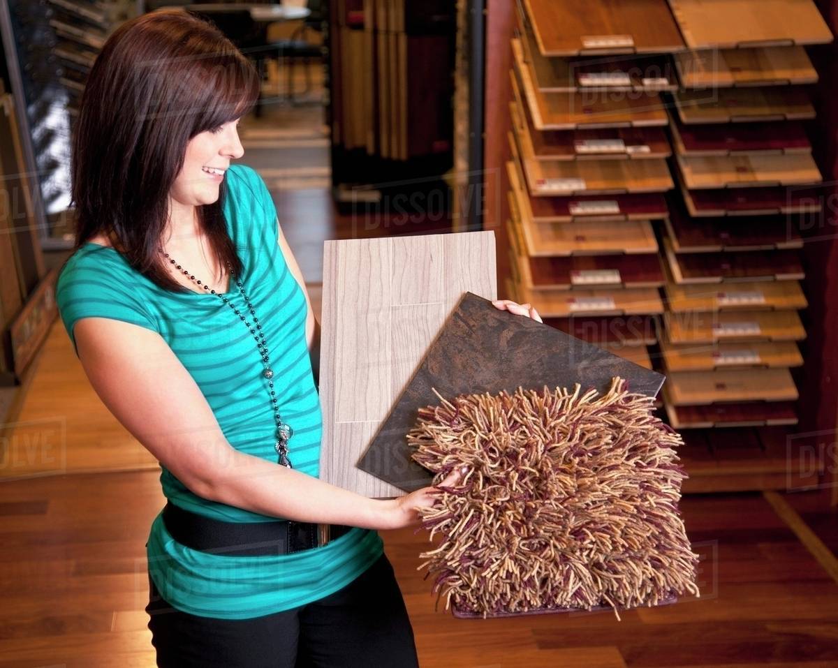 Design Consultant Showing Samples In A Retail Flooring Store; Edmonton