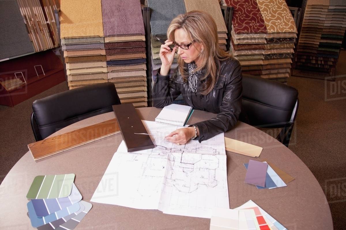 Customer Choosing Floor Coverings In A Retail Flooring Store; Edmonton