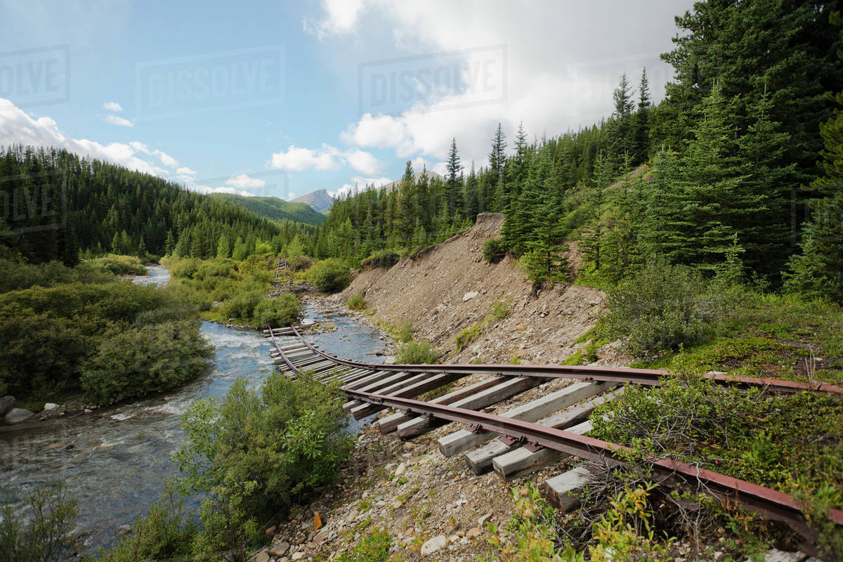Old Railway Tracks Hanging Above A Creek; Cadomin, Alberta, Canada