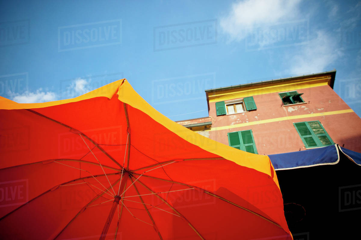Yellow And Bbue Patio Umbrellas Below A Building Vernazza Liguria Italy Yellow And Bbue Patio Umbrellas Below A Building Vernazza Liguria Italy