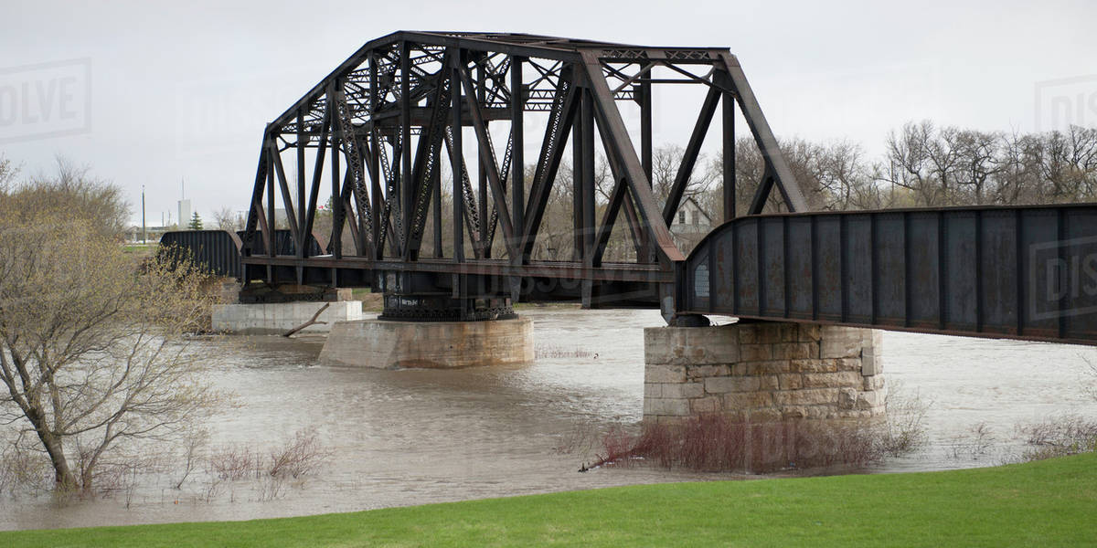A Bridge Crossing Assiniboine River With High Waters After A Flood; Headingley, Manitoba, Canada