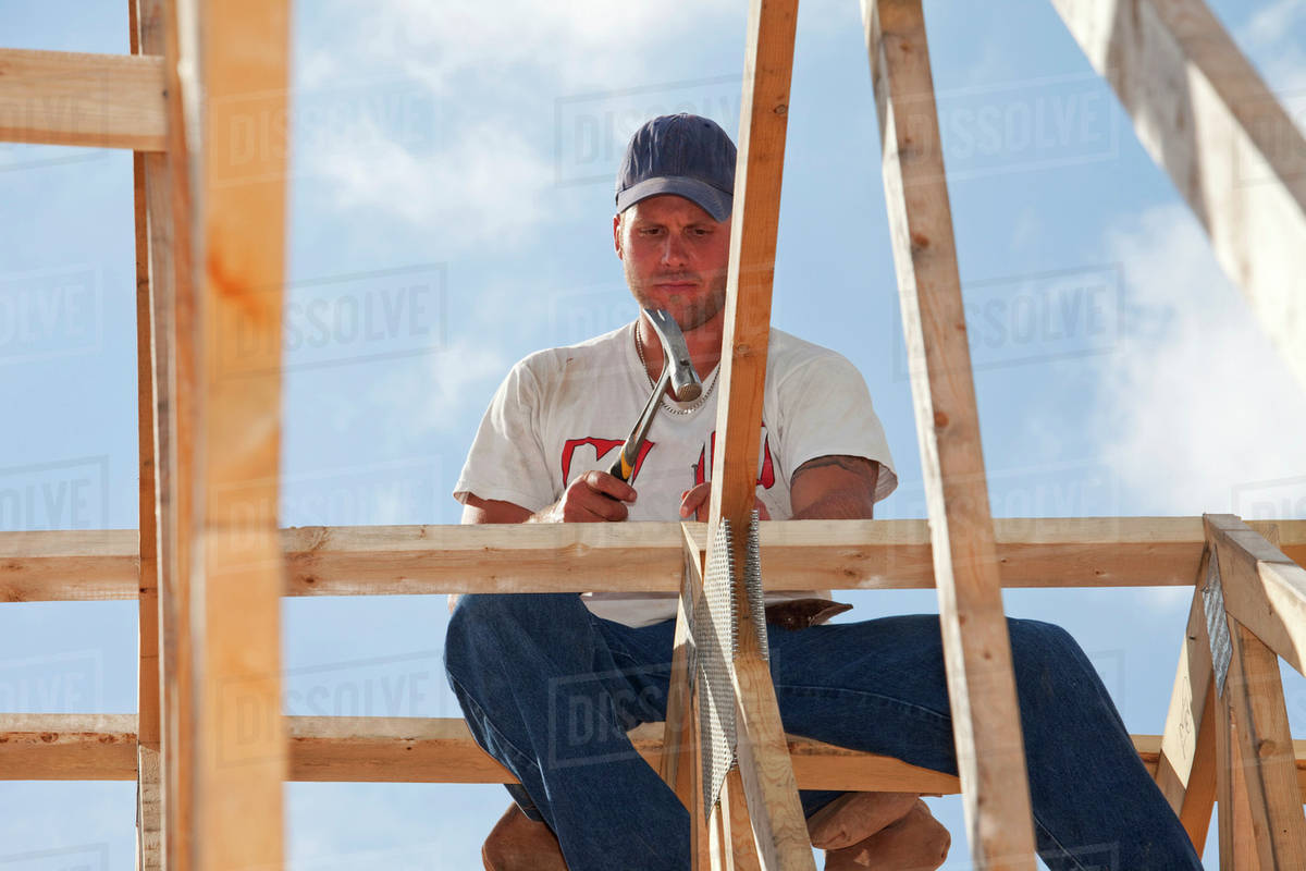 Tradesman Working On Framing For New Home Construction; St. Albert