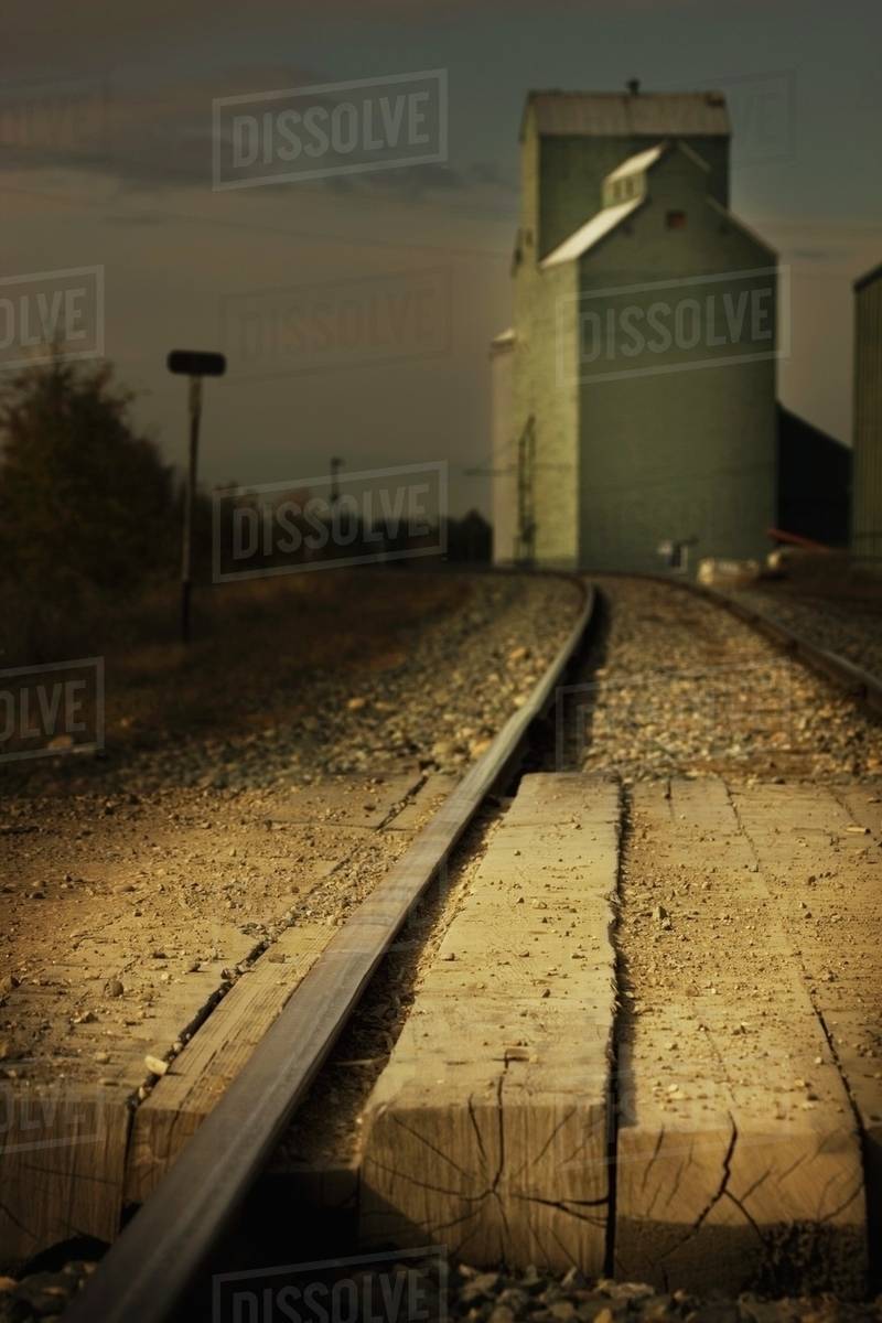 Mayerthorpe, Alberta, Canada; Grain Elevator Along Train Tracks Stock