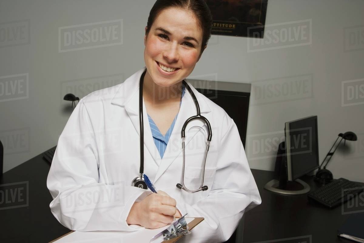 A Female Doctor In An Office; Edmonton, Alberta, Canada Stock Photo