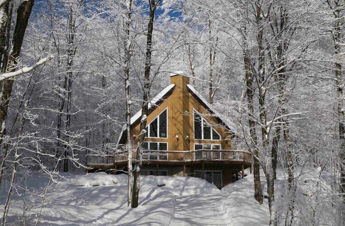 A House In The Winter; Canton De Shefford, Quebec, Canada Stock Photo