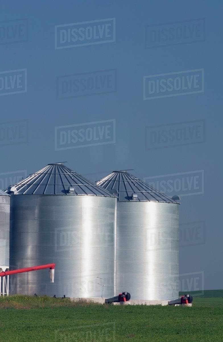 Large Metal Grain Bins, Alberta, Canada Stock Photo Dissolve