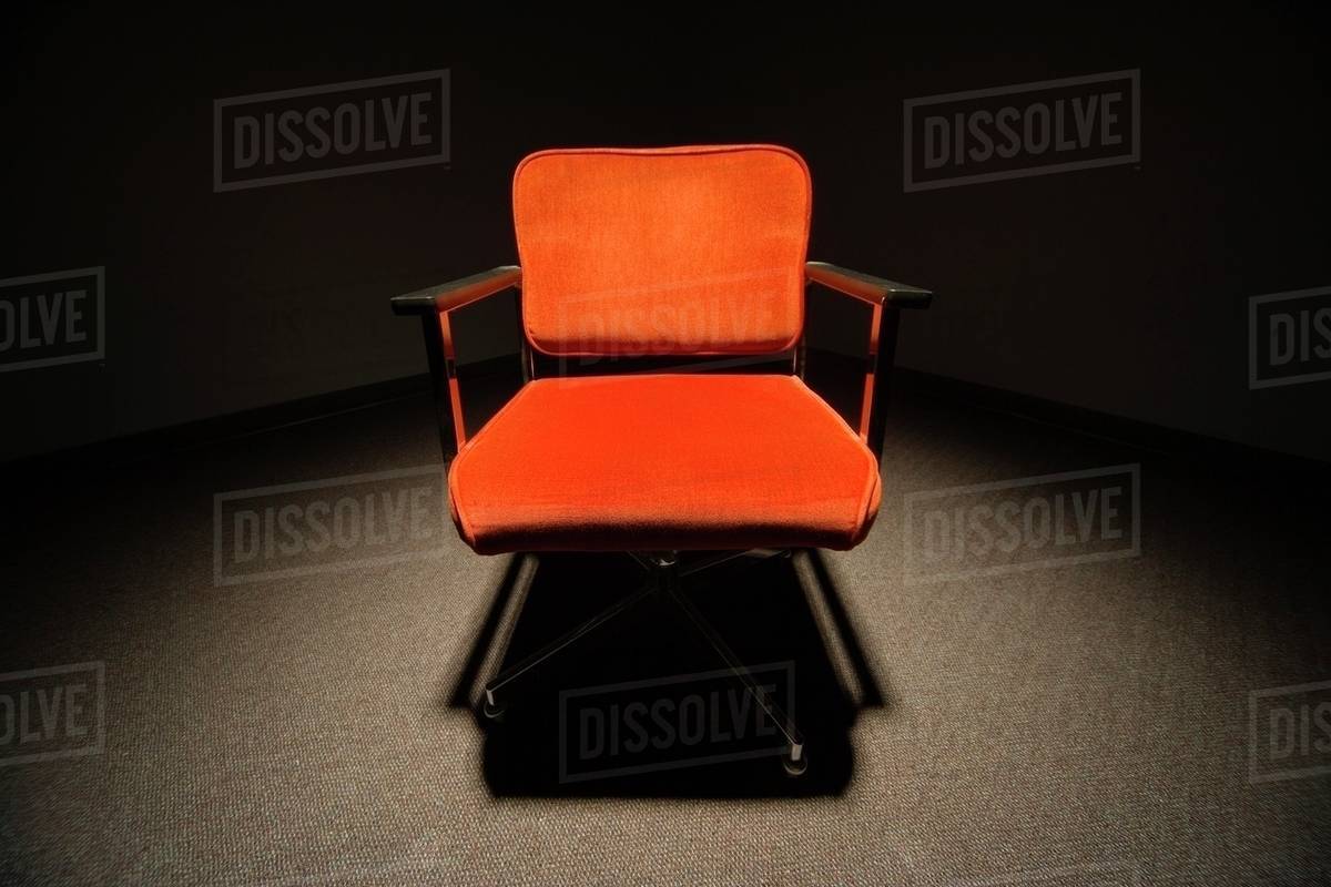 Office Chair Under A Spotlight Stock Photo Dissolve