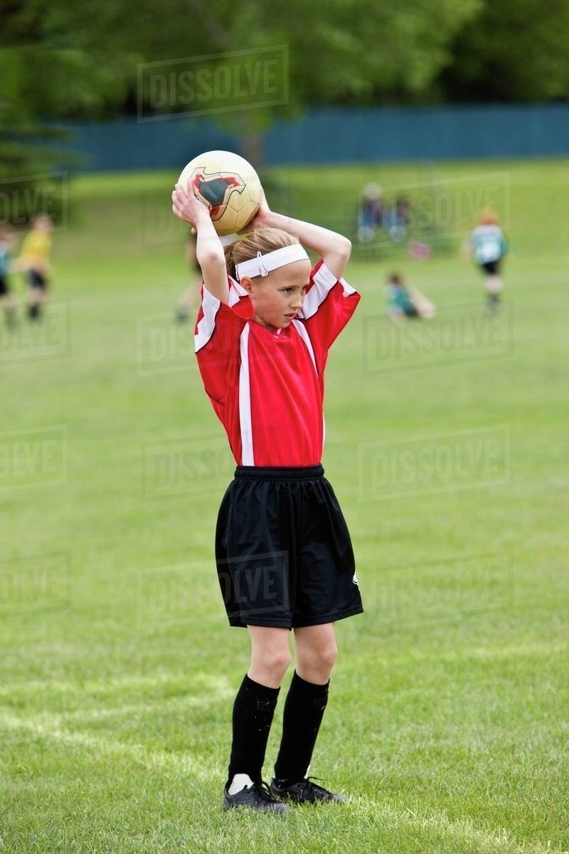 Female Soccer Player Throwing The Ball Stock Photo Dissolve