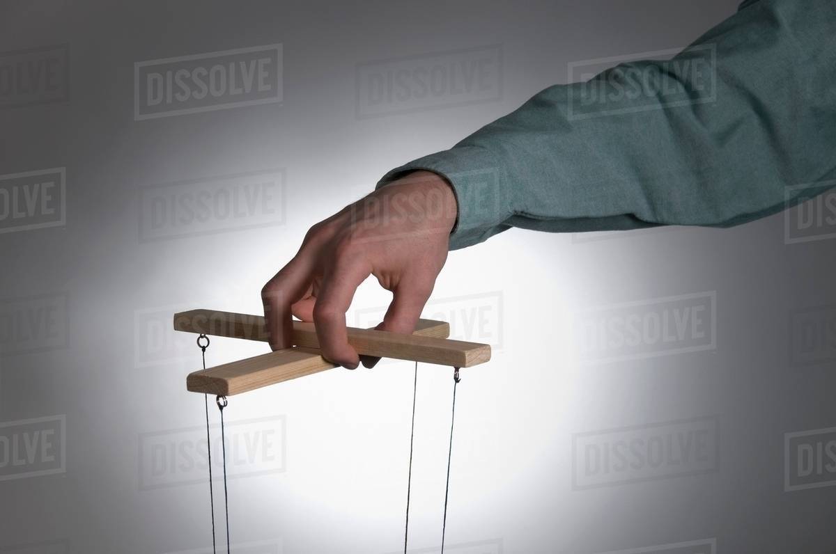 Male operating puppet controls Stock Photo Dissolve