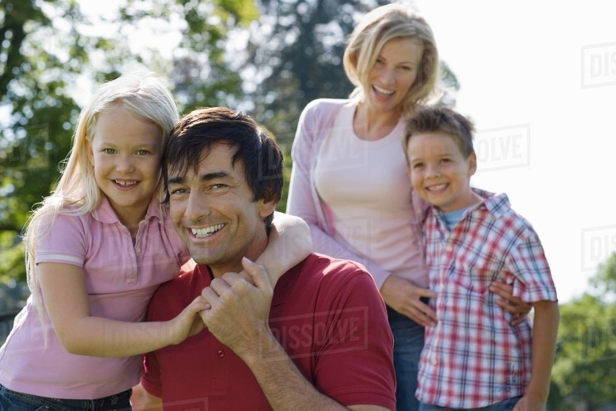 A family portrait in the park - Stock Photo - Dissolve