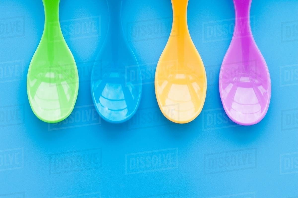 Baby plastic spoons Stock Photo Dissolve