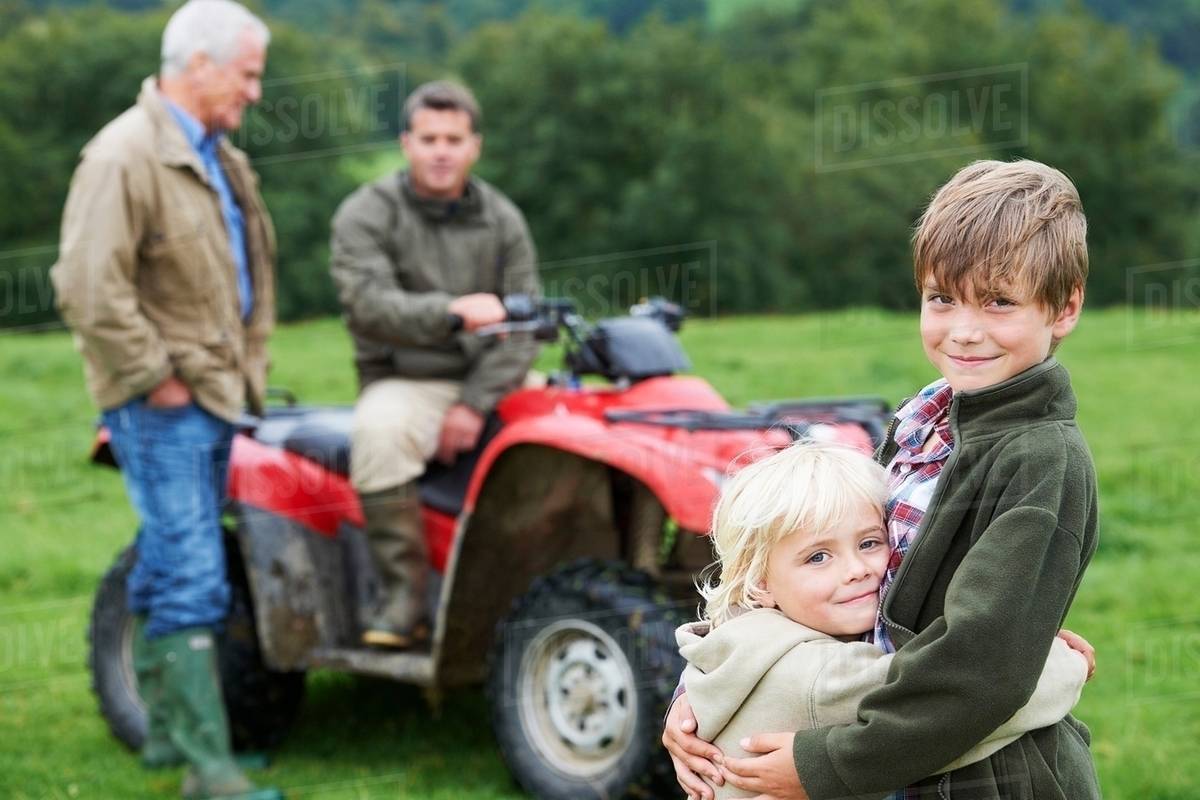 Family on quad bike Stock Photo Dissolve