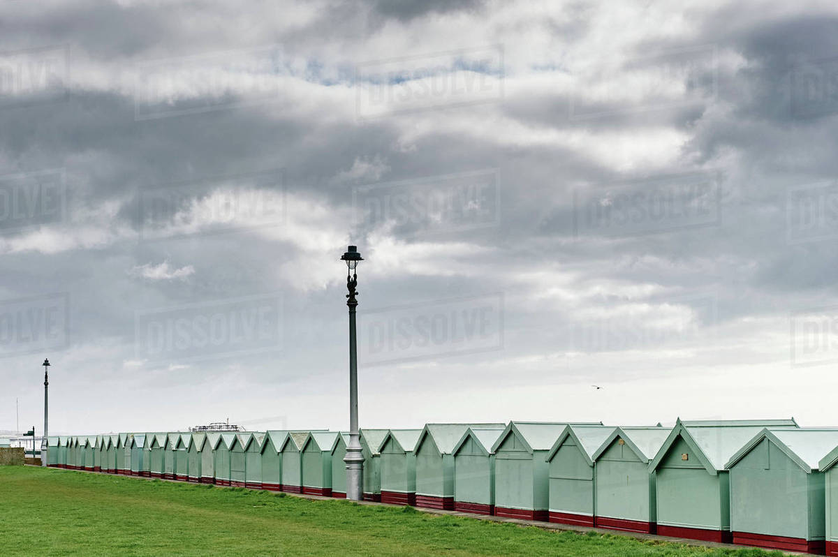 Bath houses, Brighton beach, England - Stock Photo - Dissolve