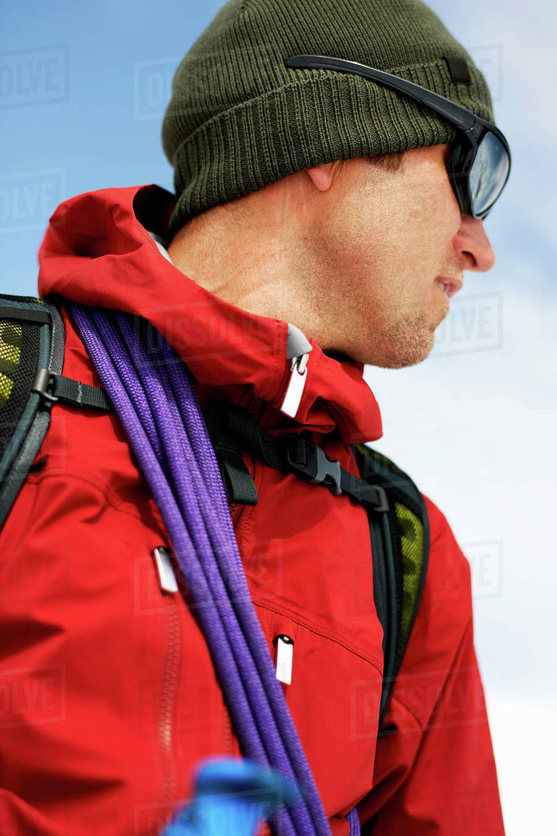 Portrait of mountaineer looking away Stock Photo Dissolve