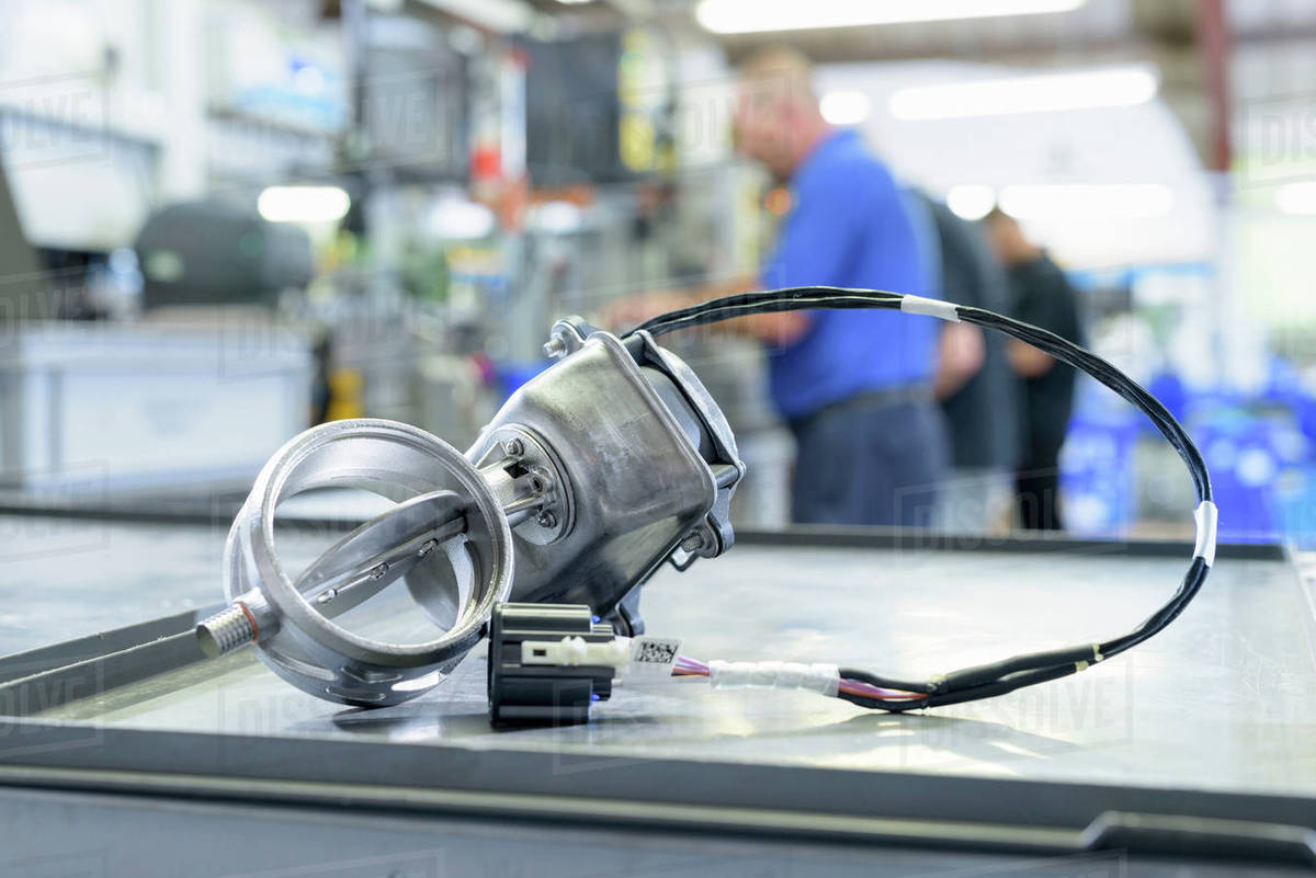 Exhaust valve with actuator on production line in factory Stock Photo