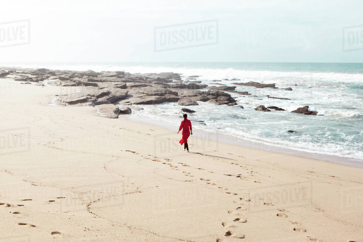 Woman Wearing Red Dress Walking Along Beach South Africa Stock Woman Wearing Red Dress Walking Along Beach South Africa