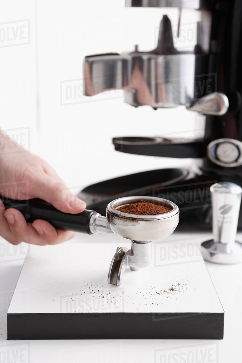 Barista using espresso machine Stock Photo Dissolve