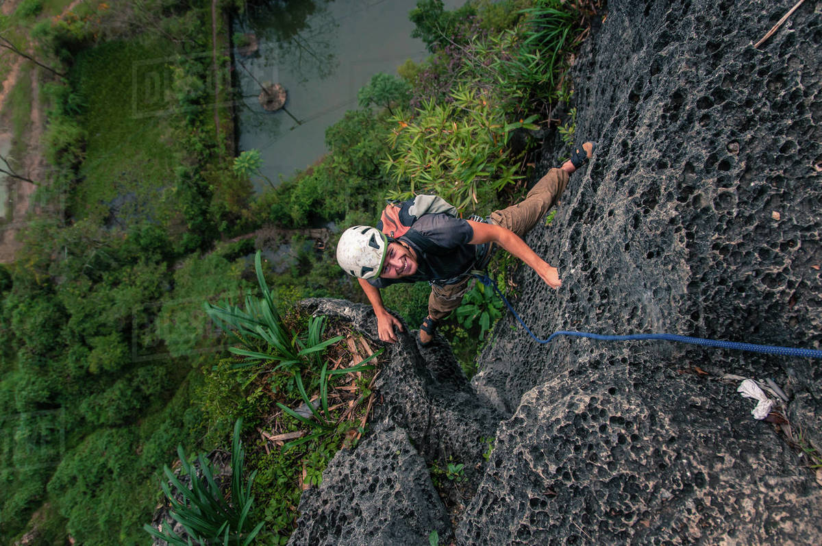 Man rock climbing Guilin Sugarloaf, high angle view, Yangshuo, Guangxi, China Royalty-free stock photo