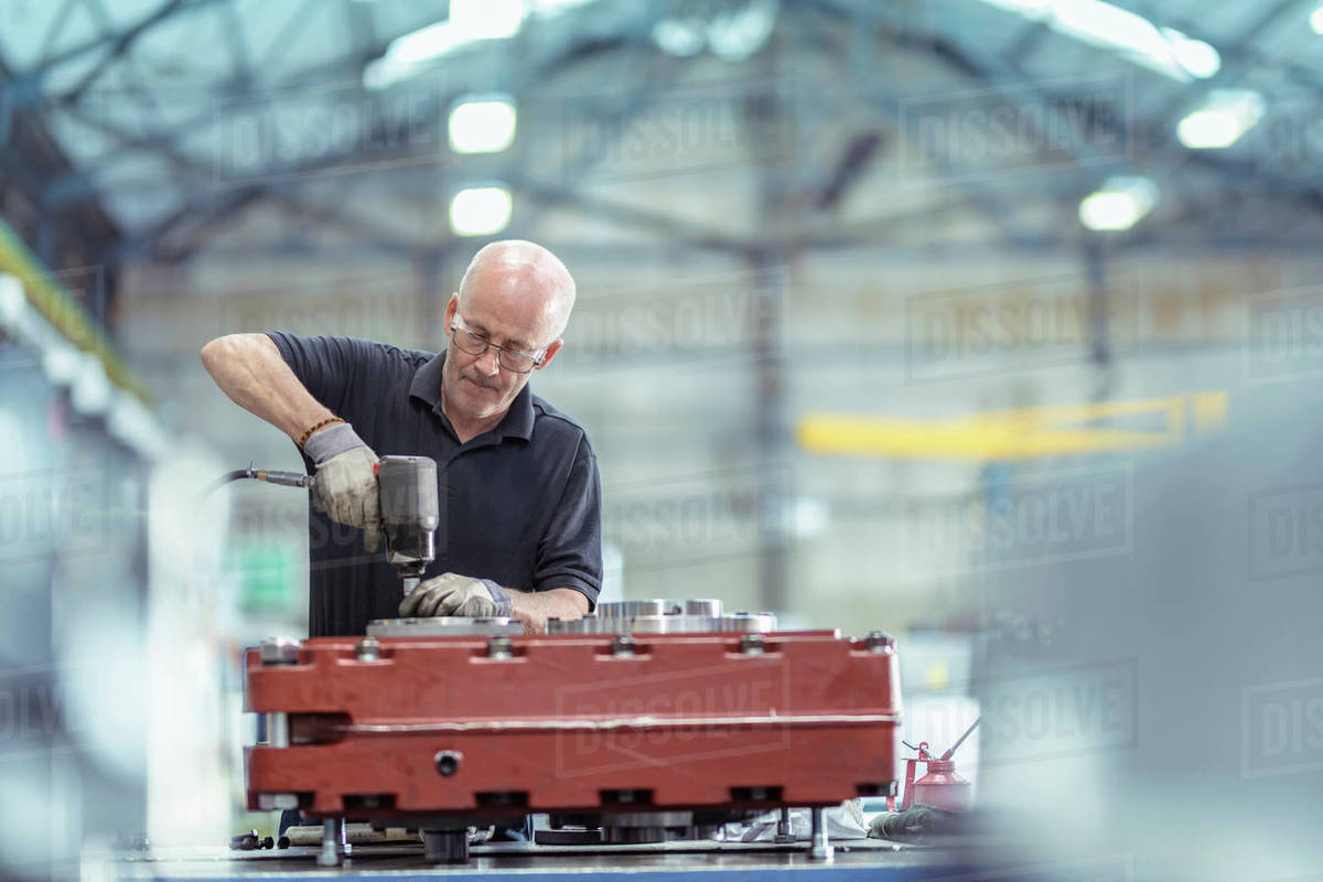 Engineer assembling gearbox in gearbox factory Stock Photo Dissolve