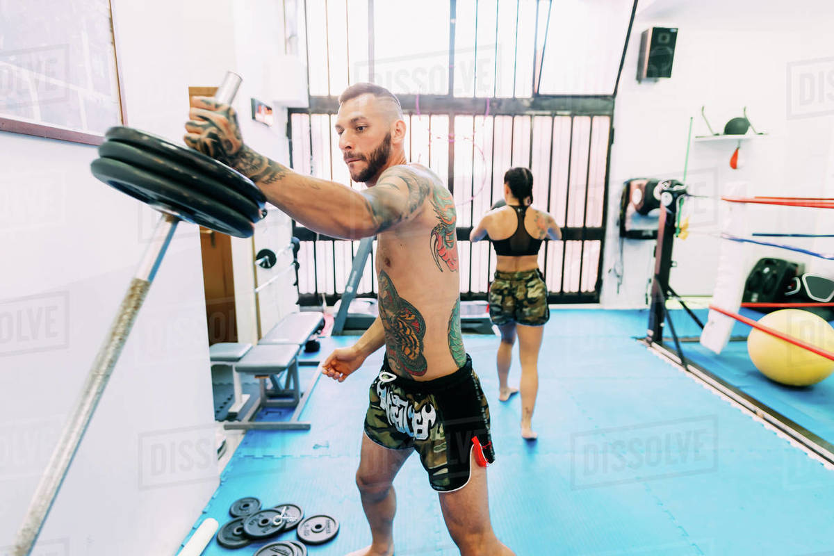 Male boxer lifting weights Stock Photo Dissolve