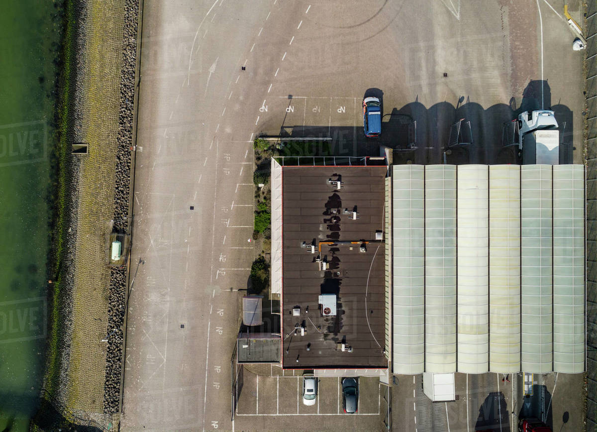 Trucks passing customs office before ferry journey to UK, overhead view
