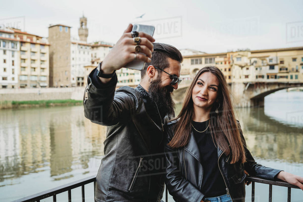 Couple taking selfie on bridge, Ponte Vecchio, Firenze, Toscana, Italy Royalty-free stock photo