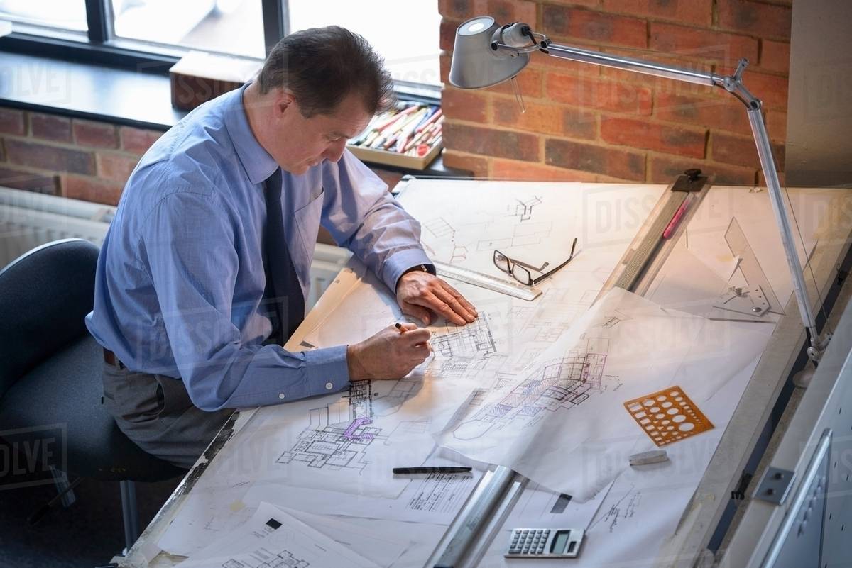 architect drawing plans at