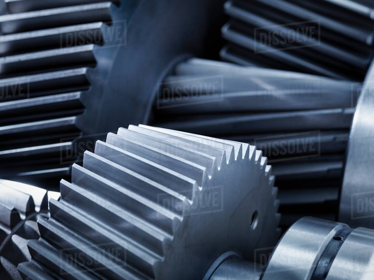 close up of gears in industrial gearbox stock photo dissolve