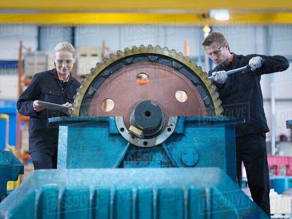 Engineers repair industrial gearbox in engineering factory - Stock ...