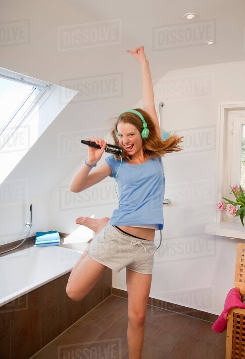 Girl singing in bathroom Stock Photo Dissolve