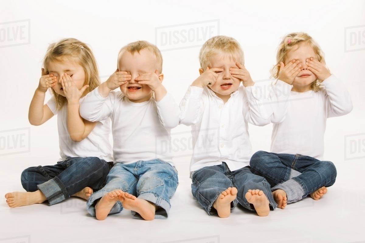 Four toddlers covering their eyes Stock Photo Dissolve