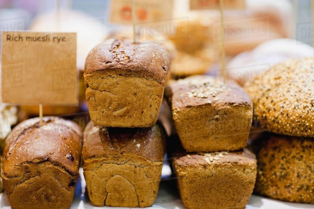 Fresh seed loaf & muesli rye bread for sale Stock Photo Dissolve