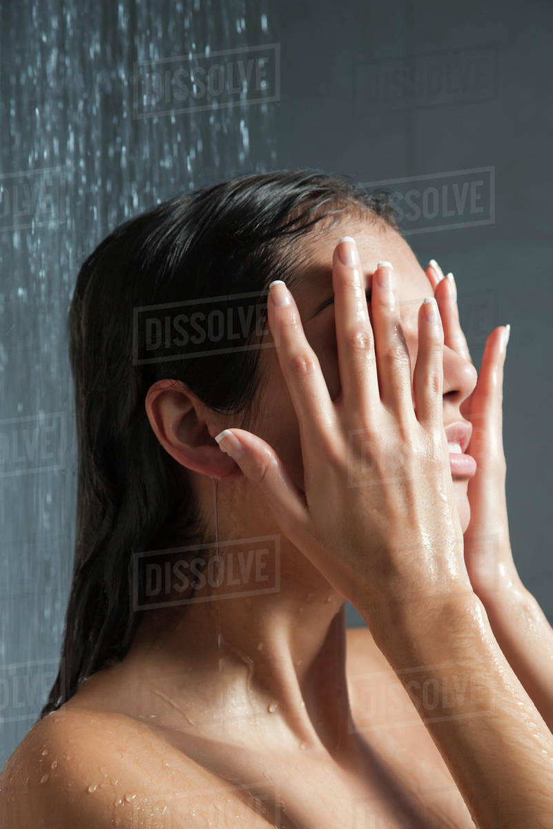 Woman Washing Face In Shower Stock Photo Dissolve Woman Washing Face In Shower