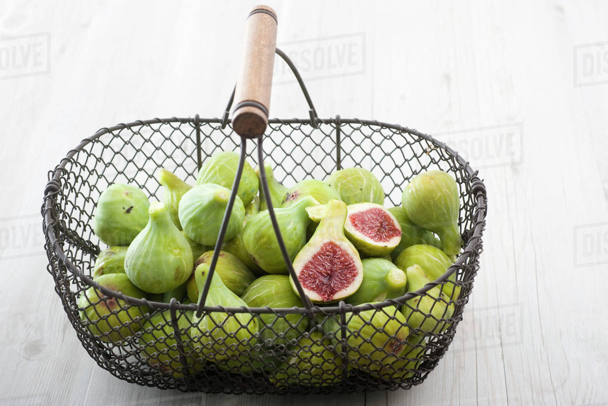 Fresh figs in basket Stock Photo Dissolve
