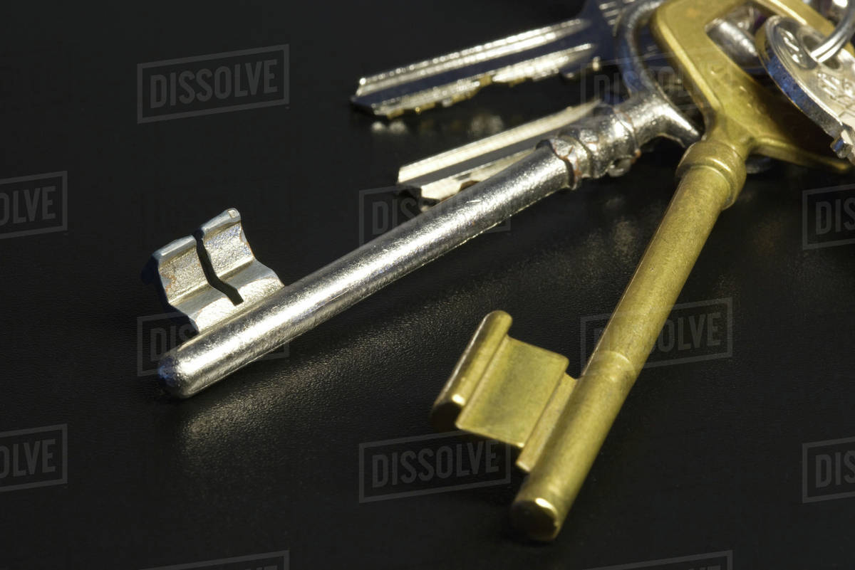 Assorted keys on keyring, closeup Stock Photo Dissolve